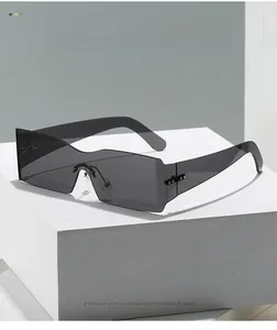 Close-up of frameless oversized one-piece square sunglasses with rivet details