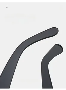 Detail of curved ergonomic temple arms on matte black rimless square sunglasses