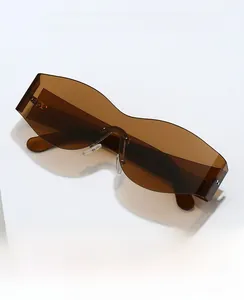 Detail view of 2024 rimless oversized sunglasses with dark brown jelly lenses and rivets