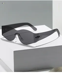 Macro detail of rimless cat-eye sunglasses with silver rivet and metal logo accents