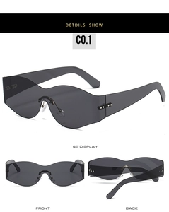 Three angles of rimless wave-shaped jelly sunglasses with dark grey lenses and metal rivets