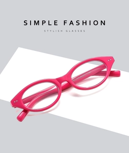 Macro detail of glossy pink cat-eye frame with metal hinges and size specs 48-20-144