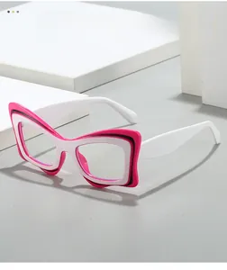 Detail of white butterfly eyeglass frame with pink and black layered wave pattern
