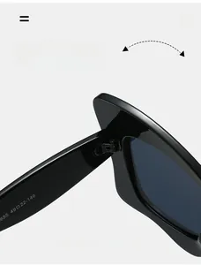 Gros plan détaillé des lunettes de soleil en acétate noir avec charnière en métal durable