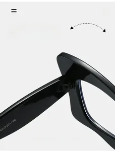Macro detail of high-quality metal hinge and inner arm size markings on black cat-eye glasses