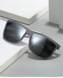 Detail of matte gray sports sunglasses with non-slip texture on a white geometric stand