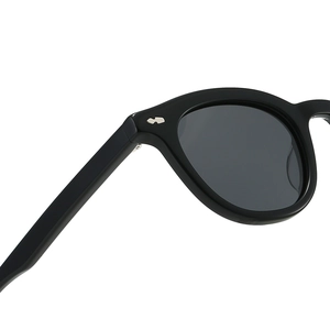 Retro black oval thick-frame sunglasses with elegant silver metal oval rivet details