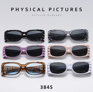 Detailed view of square sunglasses with geometric grid textures in six color variants