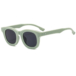 Retro mint green oval sunglasses with sleek glossy frames and dark grey tinted lenses