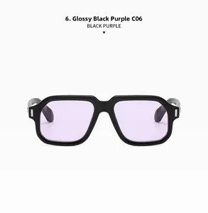 Detail of square sunglasses with bright black frame, purple lenses and silver rivets