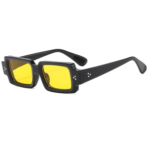 Classic black square sunglasses with yellow transparent lenses and silver rivet accents