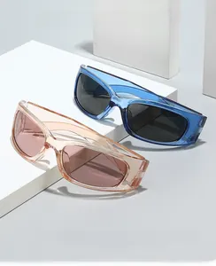 Detail of Y2K futuristic sports sunglasses in transparent blue and champagne pink frames