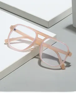 Close-up of pink square double bridge anti-blue light glasses on white geometric props