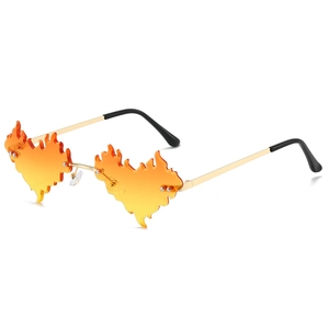 Lunettes de soleil sans monture en forme de flamme avec verres dégradés orange et monture dorée