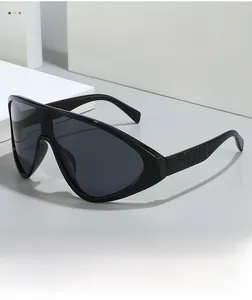 Macro view of the wide-frame sunglasses with embossed FASHION lettering on the temples