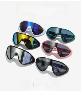 Flat lay of oversized one-piece sunglasses in six assorted colors on white background