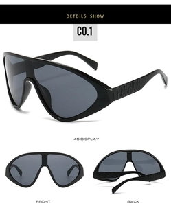 Detail view showing black oversized shield sunglasses with embossed FASHION lettering