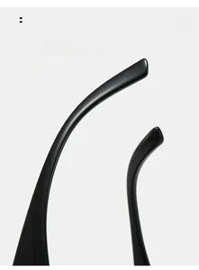 Detail of sleek black curved temple arms on sports sunglasses with XY GLASSES branding
