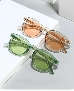 Detail of transparent square-round protective glasses with metallic hinges and durable frame