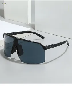 Macro detail of shield sunglasses featuring black frame with white ink splash texture