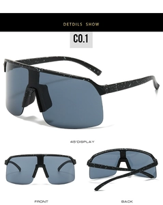 Detail view of large frame cycling sunglasses with white splatter dots on black frames