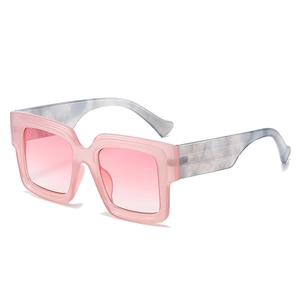 Oversized square sunglasses with pink gradient lenses and marble pattern temples