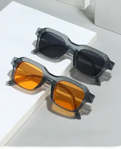 Detail of square vintage sunglasses in orange and gray tints on geometric stands