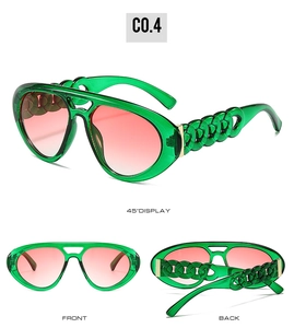 Détails de lunettes pilote avec monture verte, verres dégradés et branches chaîne épaisse