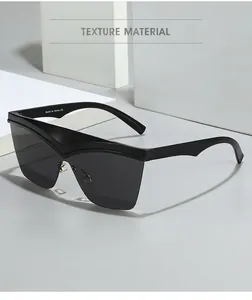 Detail of oversized polygon sunglasses featuring a stylish V-shaped white accent line