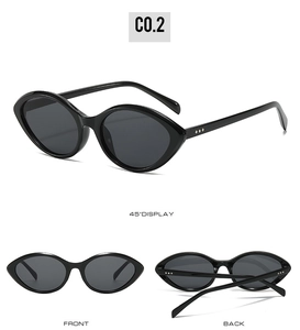 Macro detail of cat eye sunglasses featuring silver dot accents on black frames