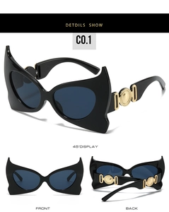 Detailed 45-degree view of bat-shaped sunglasses with golden metal temple accents