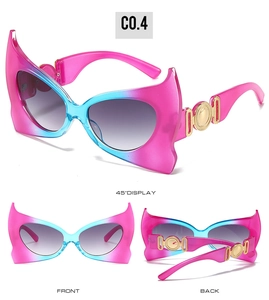 Detailed views of bat-shaped sunglasses with pink-blue gradient frame and gold metal accents