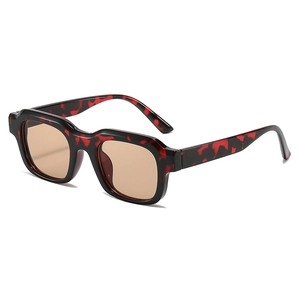 Retro square sunglasses with red-black tortoiseshell frames and amber lenses on white background