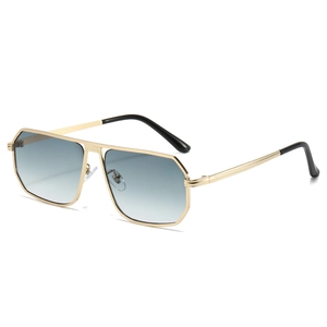 Modern oversized pilot sunglasses with gold metal frame and light blue gradient lenses