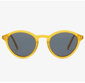 Macro detail of yellow matte frames with vintage metal rivets and dark grey lenses