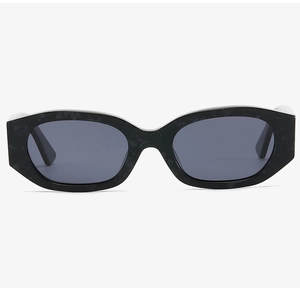 Detail view of oval thick-rimmed sunglasses with black marble texture and dark lenses