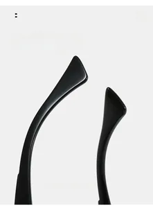 Close-up of curved ergonomic temple tips on black high-gloss resin sunglasses