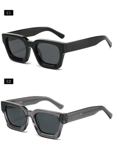 Detailed close-up of thick frames and wide temples of square oversized sunglasses
