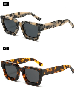 Detail view of bold square sunglasses in white floral C5 and brown tortoiseshell C6 patterns