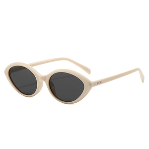 Chic cream cat-eye sunglasses with dark lenses and metal rivets on the temples