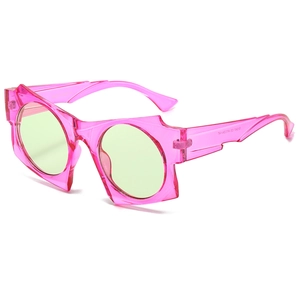 Irregular pink geometric sunglasses with green lenses and UV protection for street style