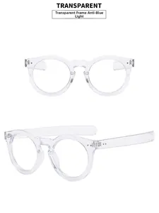 Detailed view of transparent round blue light blocking glasses with stylish rivet accents