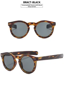 Vue détaillée des lunettes de soleil rondes rétro avec monture écaille et rivets