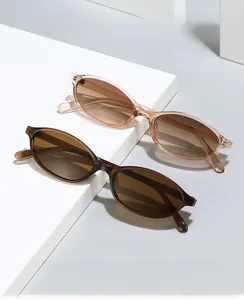 Detail view of retro oval sunglasses in brown and champagne on geometric display