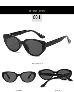 Detailed views of glossy black cat-eye sunglasses with polished metal hinge accents