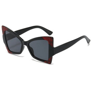 Lunettes de soleil papillon œil de chat modernes avec monture noire et détails en écaille
