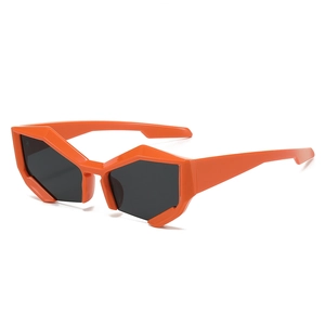 Fashionable rimless orange sunglasses with dark lenses and geometric cut edges