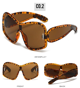 Three-way view of tortoise frame oversized shield sunglasses with brown lenses