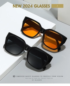 Detailed view of stylish black and orange square frame sunglasses on a minimalist stand