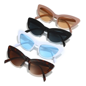 Cat eye sunglasses in pink, black, white and tortoiseshell stacked on white background